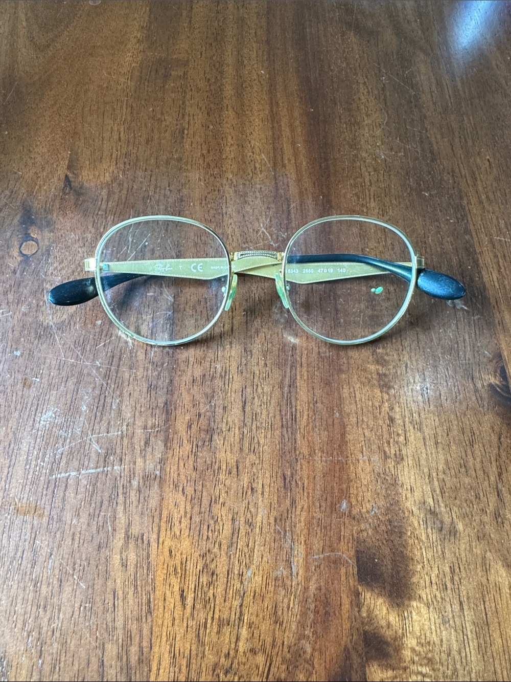 Ray-Ban Round Titanium Ultralight Women's Glasses in Gold